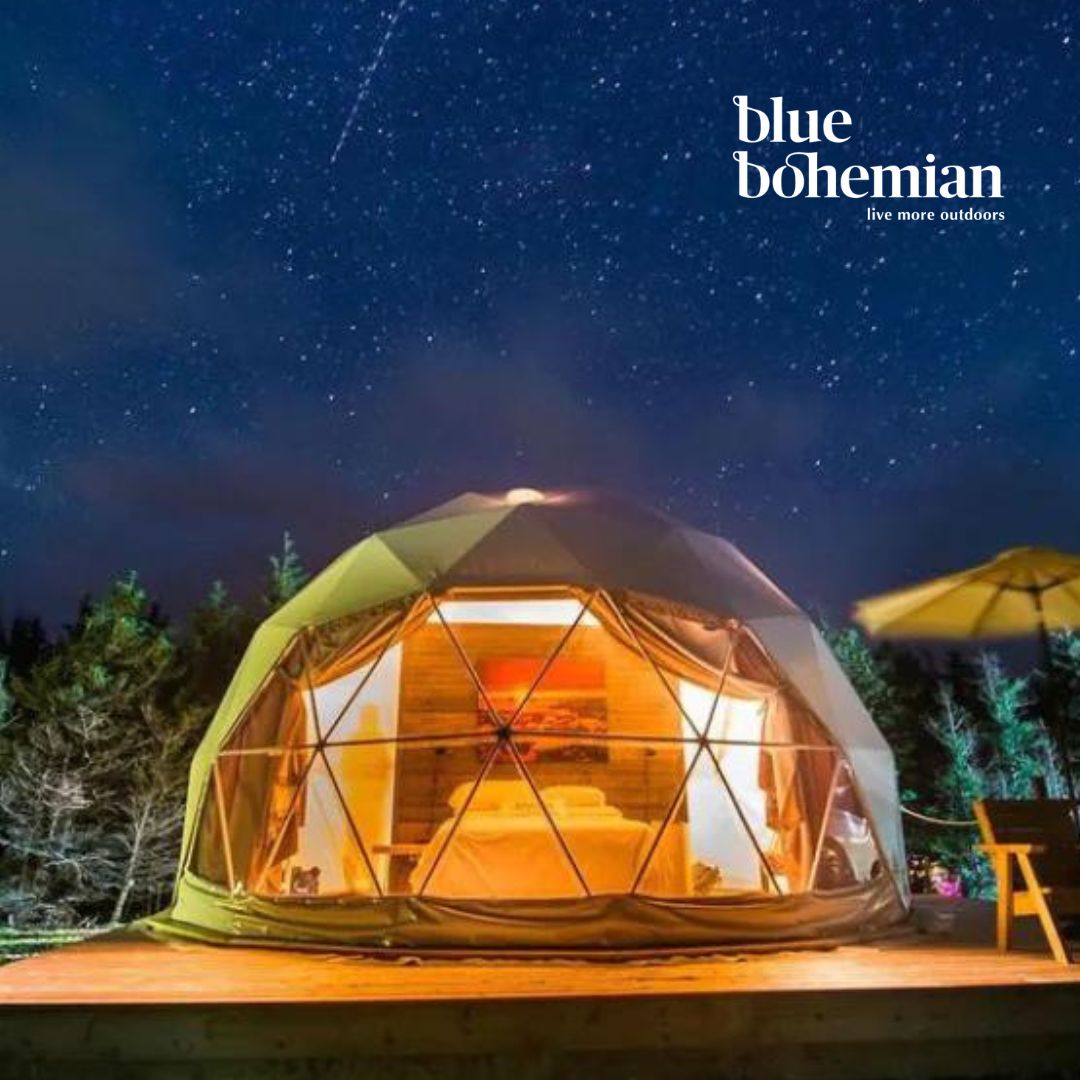 Geodesic dome tent under a starry night sky with 'blue bohemian' branding.